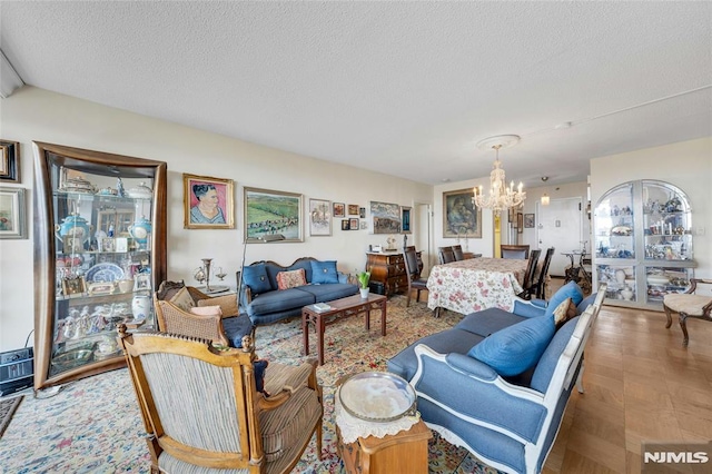 1530 Palisade Ave Unit 21M, Fort Lee, NJ 07024 - living area featuring a chandelier and a textured ceiling