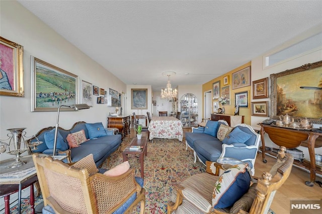 1530 Palisade Ave Unit 21M, Fort Lee, NJ 07024 - living area with a chandelier and a textured ceiling