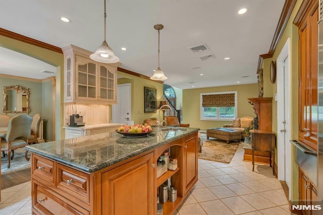 20 W Crescent Ave, Mahwah, NJ 07430 - kitchen with a sink, crown molding, light tile patterned floors, open floor plan, and glass insert cabinets