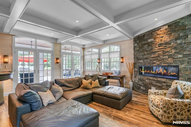 20 W Crescent Ave, Mahwah, NJ 07430 - living room with french doors, coffered ceiling, wood-type flooring, a stone fireplace, and beamed ceiling