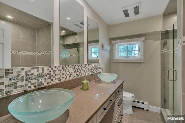 20 W Crescent Ave, Mahwah, NJ 07430 - full bath featuring baseboard heating, a stall shower, double vanity, tasteful backsplash, and toilet