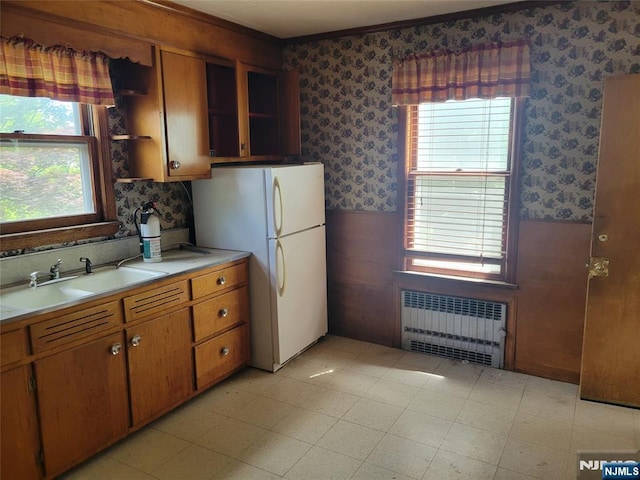 55 James, Bloomfield, NJ 07003 - kitchen featuring radiator, wallpapered walls, a sink, freestanding refrigerator, and plenty of natural light