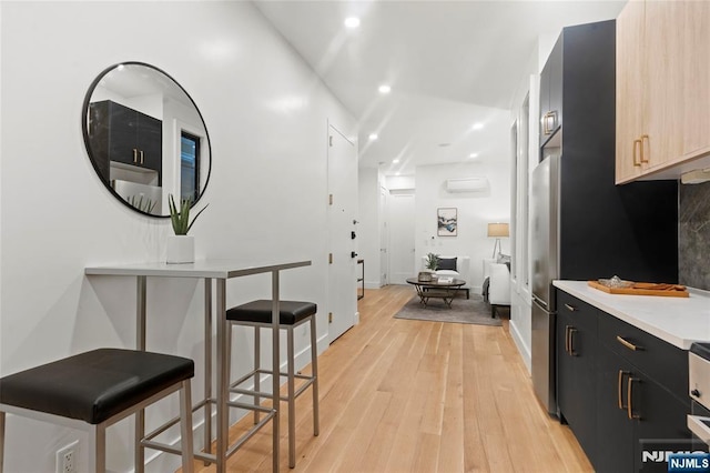 50 Grace St Unit 2R, Jersey City, NJ 07307 - hallway featuring light wood-style floors, recessed lighting, and baseboards