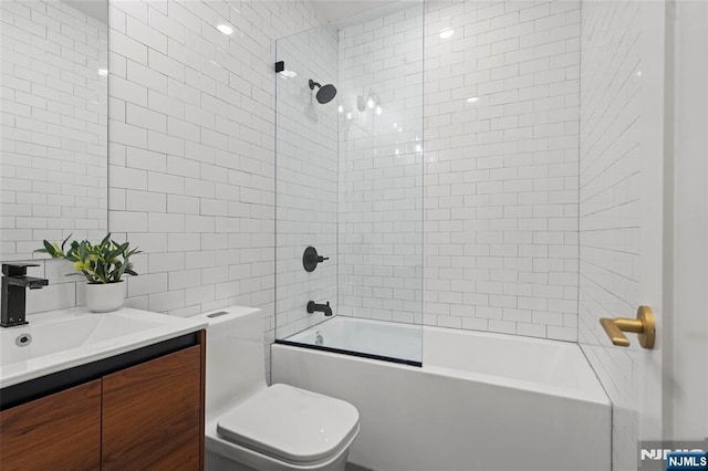 50 Grace St Unit 2R, Jersey City, NJ 07307 - full bath featuring tile walls, toilet, vanity, shower / tub combination, and backsplash