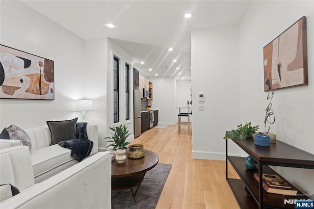 50 Grace St Unit 2R, Jersey City, NJ 07307 - living room with light wood-type flooring, recessed lighting, and baseboards