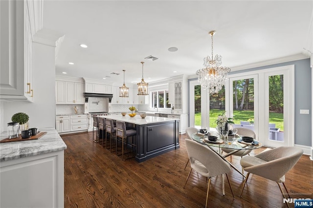 504 Kendrick St, Paramus, NJ 07652 - dining area with a chandelier, dark wood-type flooring, crown molding, and recessed lighting