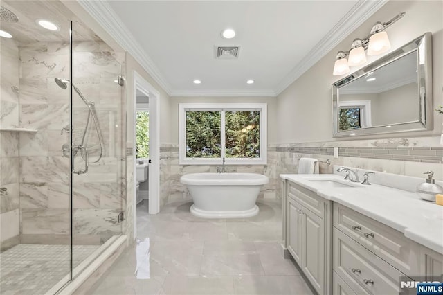504 Kendrick St, Paramus, NJ 07652 - bathroom featuring a marble finish shower, vanity, a freestanding tub, ornamental molding, and tile walls