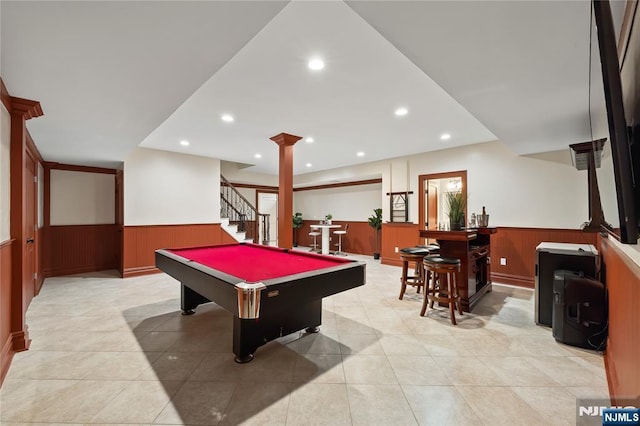 504 Kendrick St, Paramus, NJ 07652 - game room featuring wainscoting, billiards table, bar area, ornate columns, and light tile patterned floors
