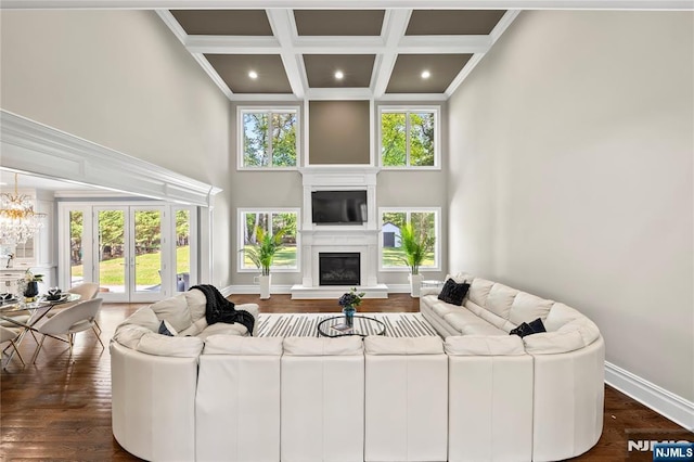 504 Kendrick St, Paramus, NJ 07652 - living room with a high ceiling, coffered ceiling, plenty of natural light, a glass covered fireplace, and beam ceiling