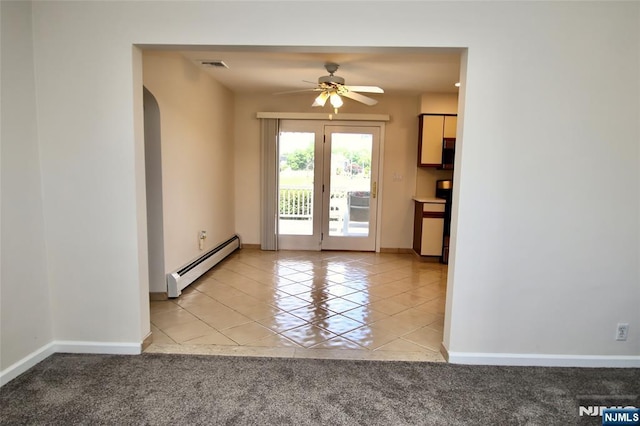 37 Winslow Ter, Fair Lawn, NJ 07410 - spare room featuring a baseboard radiator, arched walkways, light tile patterned flooring, a ceiling fan, and baseboards