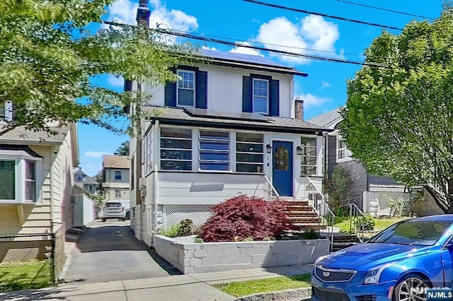 107 Elm St, West Orange, NJ 07052 - view of front of house with solar panels and entry steps