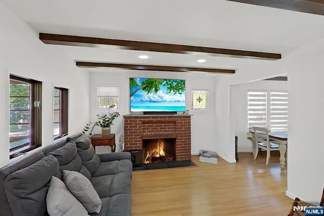 107 Elm St, West Orange, NJ 07052 - living room with beam ceiling, light wood-type flooring, baseboards, a brick fireplace, and recessed lighting