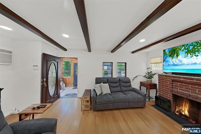 107 Elm St, West Orange, NJ 07052 - living room with beamed ceiling, a fireplace, light wood-style flooring, recessed lighting, and baseboards