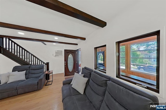 107 Elm St, West Orange, NJ 07052 - living area featuring beamed ceiling, light wood-type flooring, an AC wall unit, stairway, and recessed lighting