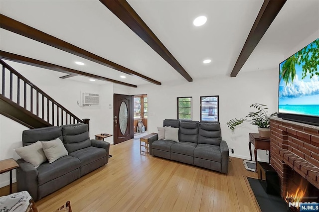 107 Elm St, West Orange, NJ 07052 - living area featuring beam ceiling, light wood-style floors, a brick fireplace, recessed lighting, and a wall mounted AC