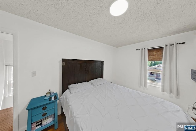 107 Elm St, West Orange, NJ 07052 - bedroom featuring a textured ceiling and wood finished floors
