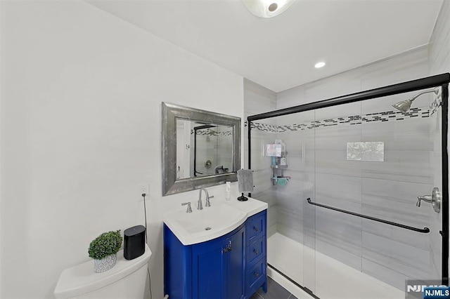 107 Elm St, West Orange, NJ 07052 - bathroom featuring toilet, vanity, and a stall shower