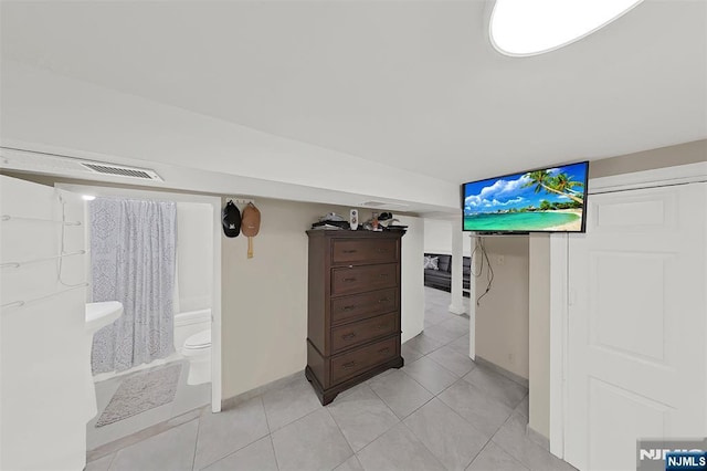 107 Elm St, West Orange, NJ 07052 - bedroom with light tile patterned floors and baseboards