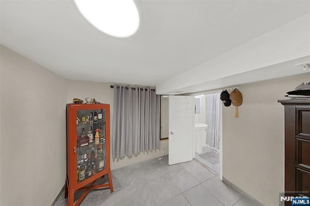107 Elm St, West Orange, NJ 07052 - interior space with light tile patterned floors and connected bathroom