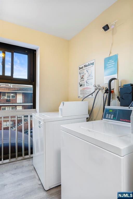201 12th St Unit 20, Palisades Park, NJ 07650 - laundry room with independent washer and dryer and wood finished floors