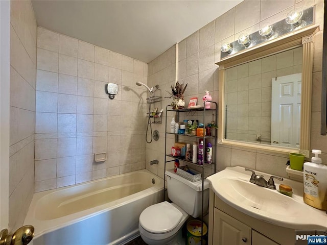 201 12th St Unit 20, Palisades Park, NJ 07650 - bathroom with tile walls, vanity, toilet, and shower / washtub combination