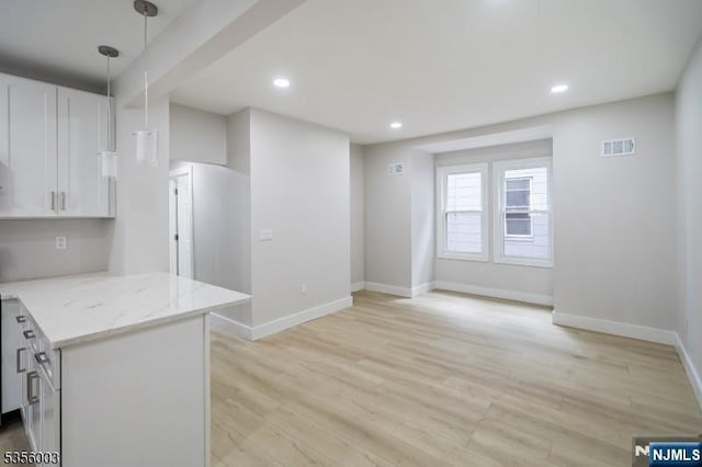 90 N Grove St, East Orange, NJ 07017 - kitchen featuring baseboards, white cabinetry, light wood-style floors, light stone counters, and recessed lighting