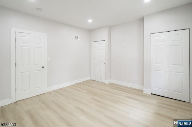 90 N Grove St, East Orange, NJ 07017 - unfurnished bedroom with recessed lighting, light wood-style flooring, and baseboards