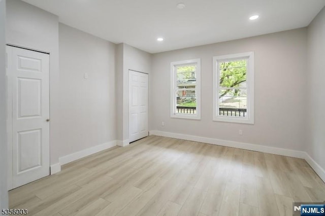 90 N Grove St, East Orange, NJ 07017 - unfurnished bedroom featuring light wood-type flooring, baseboards, and recessed lighting