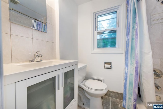 33 Lorelei Rd, West Orange, NJ 07052 - full bathroom with toilet, vanity, shower / tub combo, and decorative backsplash