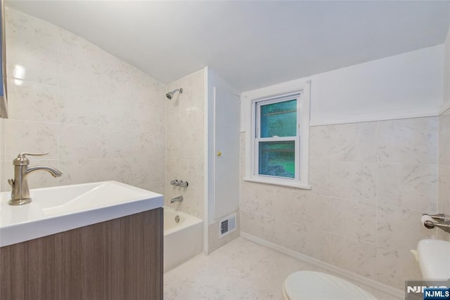33 Lorelei Rd, West Orange, NJ 07052 - bathroom with tile walls,  shower combination, toilet, and vanity