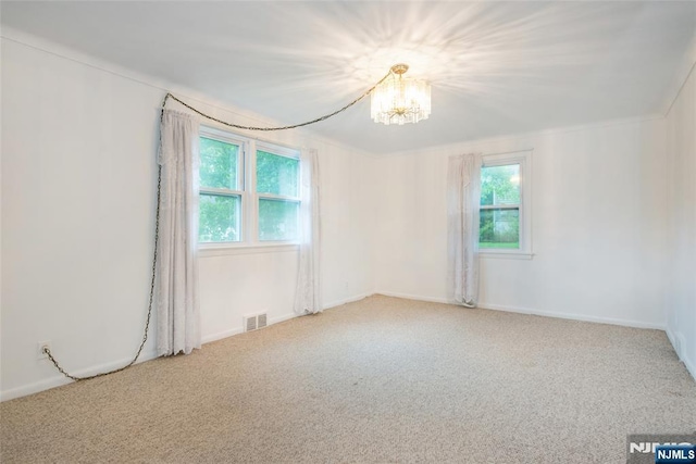 33 Lorelei Rd, West Orange, NJ 07052 - carpeted spare room with healthy amount of natural light, a chandelier, and baseboards