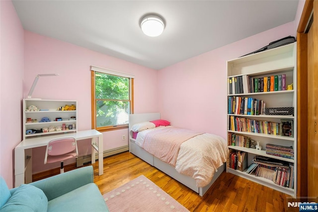 67 Short Pl, Cresskill, NJ 07626 - bedroom featuring wood finished floors and a baseboard heating unit