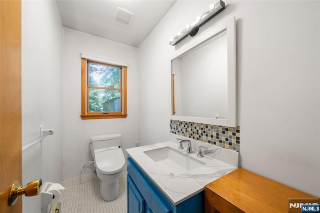 67 Short Pl, Cresskill, NJ 07626 - bathroom featuring toilet, backsplash, vanity, and tile patterned flooring