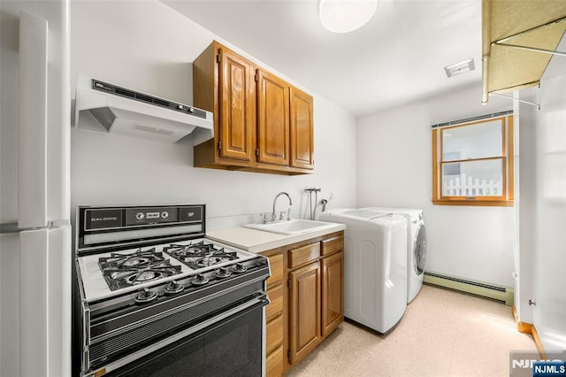 67 Short Pl, Cresskill, NJ 07626 - washroom with baseboard heating, washer and dryer, and light floors