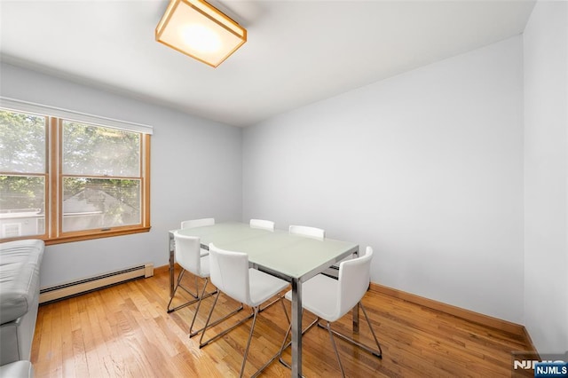 67 Short Pl, Cresskill, NJ 07626 - dining area with a baseboard radiator, light wood-type flooring, and baseboards