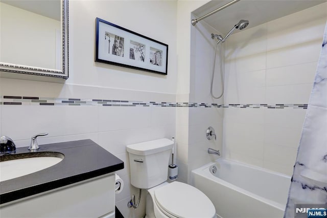 2 Jacobs Lndg, Secaucus, NJ 07094 - bathroom featuring shower / bath combo with shower curtain, toilet, vanity, and tile walls