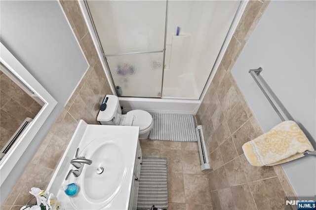 15 Kossuth St, Wallington, NJ 07057 - full bathroom featuring tile walls, a baseboard heating unit, vanity, toilet, and tile patterned floors