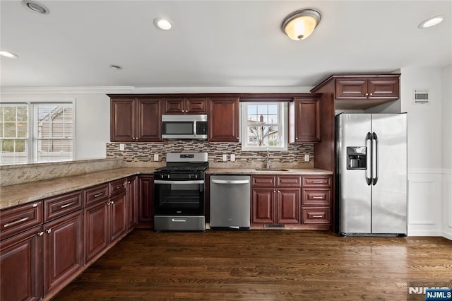 15 Kossuth St, Wallington, NJ 07057 - kitchen featuring stainless steel appliances, a sink, dark wood finished floors, backsplash, and recessed lighting