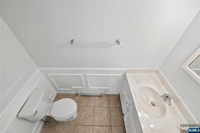 15 Kossuth St, Wallington, NJ 07057 - half bath featuring vanity, toilet, and tile patterned flooring