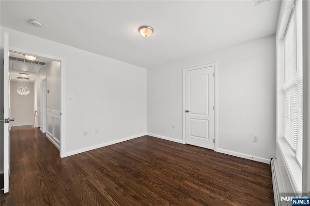 15 Kossuth St, Wallington, NJ 07057 - unfurnished bedroom featuring baseboard heating, wood finished floors, attic access, and baseboards