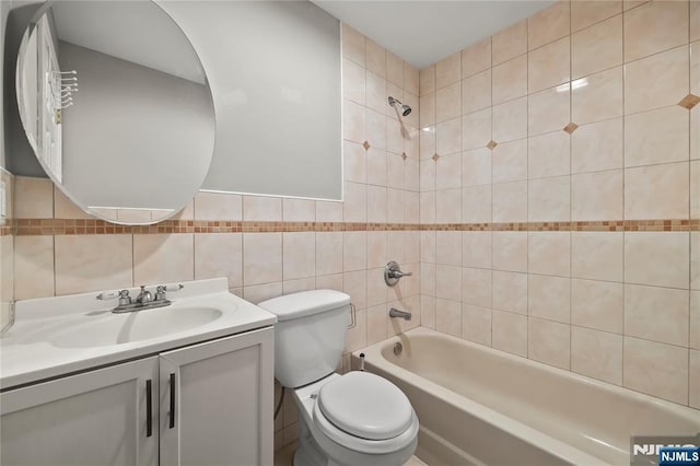 15 Kossuth St, Wallington, NJ 07057 - full bathroom featuring shower / bathtub combination, vanity, toilet, and tile walls