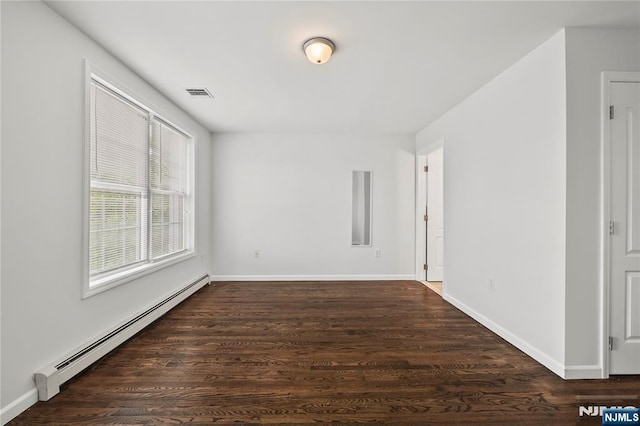 15 Kossuth St, Wallington, NJ 07057 - empty room with a baseboard radiator, wood finished floors, and baseboards