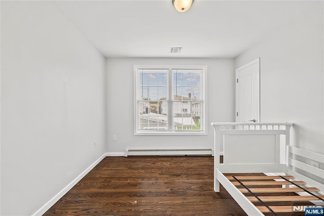 15 Kossuth St, Wallington, NJ 07057 - interior space with a baseboard heating unit, wood finished floors, and baseboards