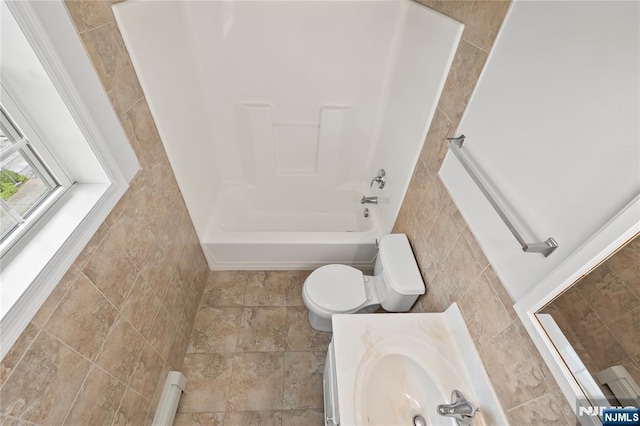 15 Kossuth St, Wallington, NJ 07057 - bathroom featuring tile walls, toilet, bathing tub / shower combination, and vanity