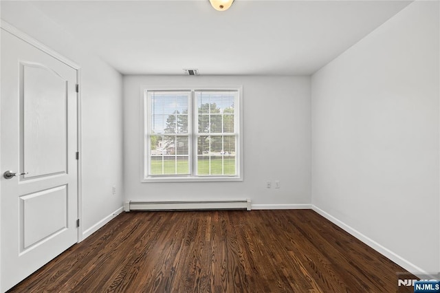 15 Kossuth St, Wallington, NJ 07057 - empty room with a baseboard heating unit, dark wood-style floors, and baseboards