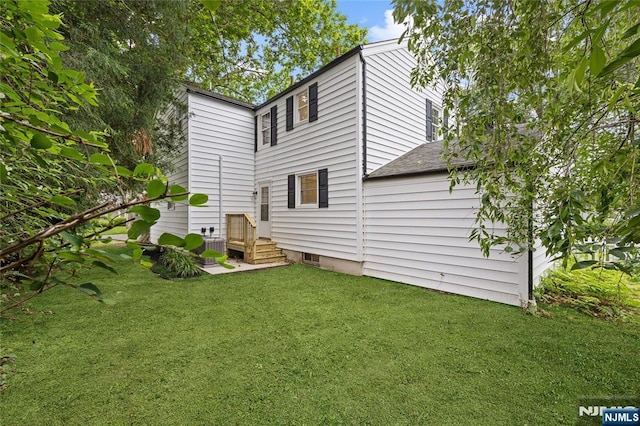 428 Elm Ave, River Edge, NJ 07661 - rear view of house featuring a yard and a shingled roof