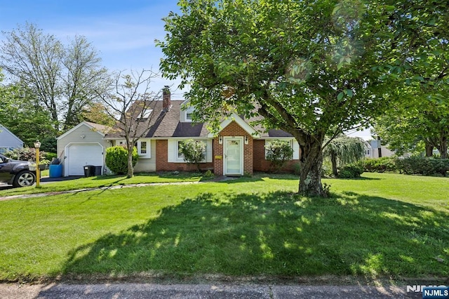 650 5th Ave, River Edge, NJ 07661 - view of front of house featuring brick siding, a front yard, asphalt driveway, a chimney, and an attached garage