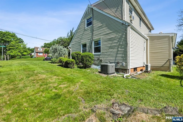 650 5th Ave, River Edge, NJ 07661 - view of home's exterior featuring central air condition unit and a yard