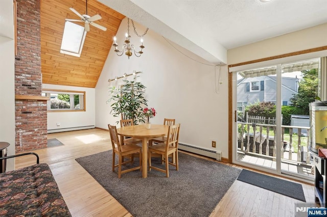 650 5th Ave, River Edge, NJ 07661 - dining area with a baseboard radiator, a baseboard heating unit, wood finished floors, ceiling fan, and high vaulted ceiling