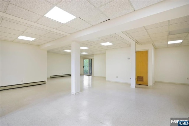 33 Willow Brk, North Caldwell, NJ 07006 - unfurnished room with a baseboard heating unit, a drop ceiling, tile patterned floors, and baseboards